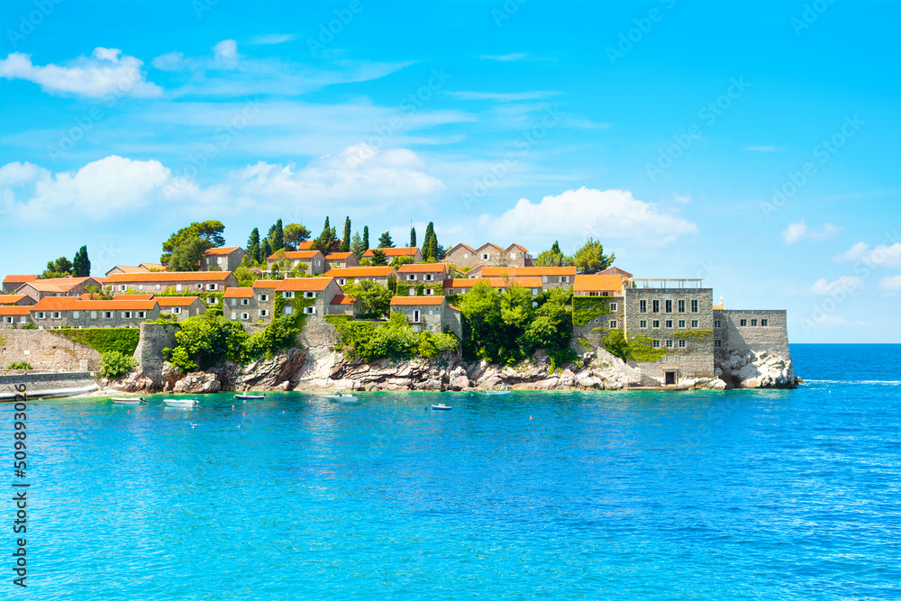 Fototapeta premium Beautiful summer landscape of the Adriatic coast in The Budva Riviera with a view of the Sveti Stefan