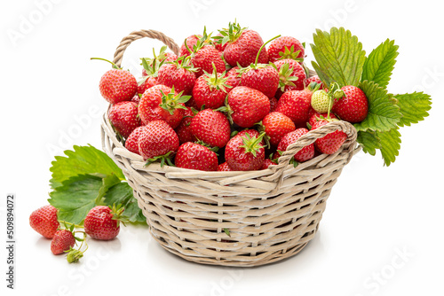 Ripe strawberries in a basket on a white background