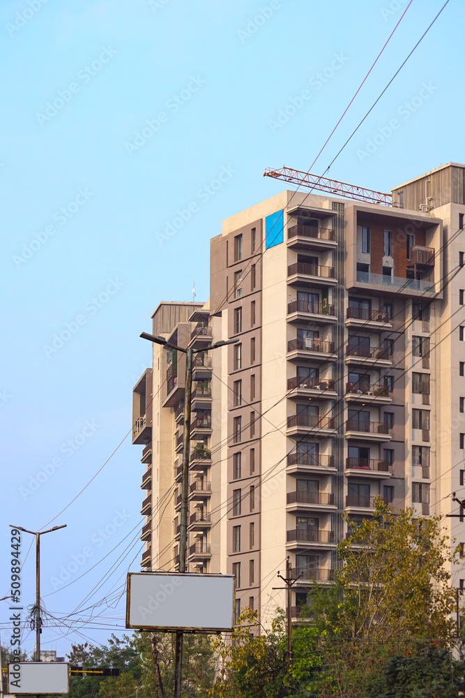 Beautiful modern residential or commercial apartment flat building exterior. Fragment of New luxury house and home flat complex. Part of City Real estate property and architecture including blue sky. Beautiful modern residential or commercial apartment flat building exterior. Fragment of New luxury house and home flat complex. Part of City Real estate property and architecture including blue sky.