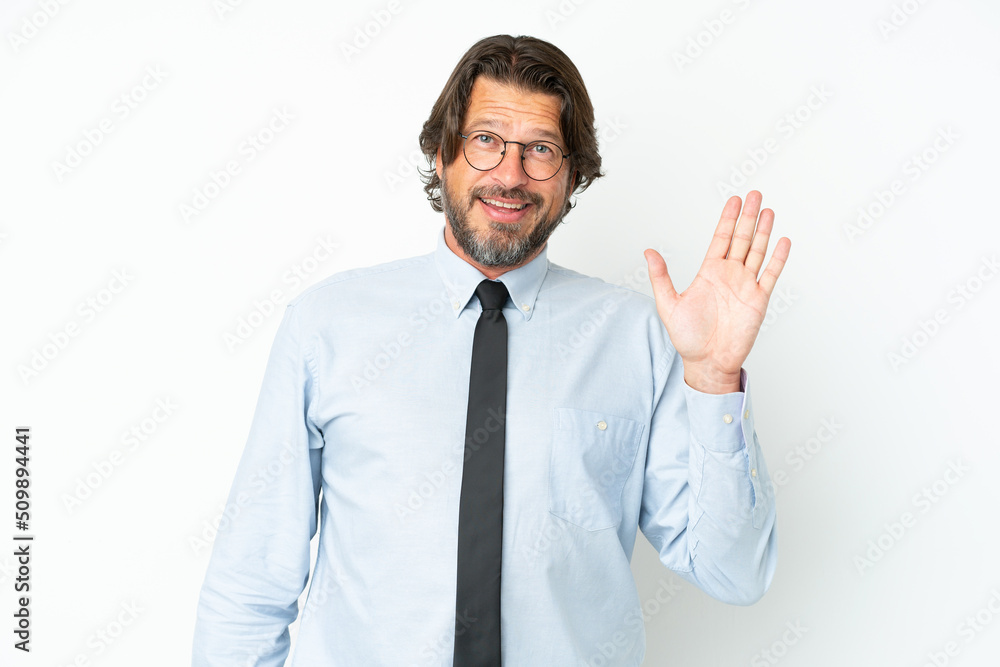 Senior dutch business man isolated on white background saluting with hand with happy expression Senior dutch business man isolated on white background saluting with hand with happy expression
