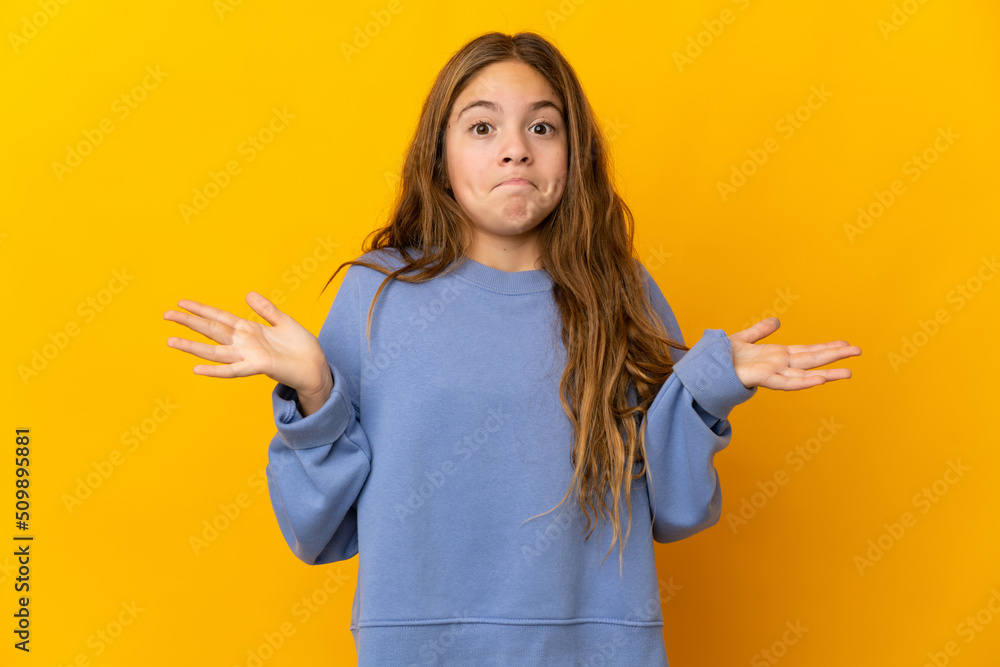Child over isolated yellow background making doubts gesture Child over isolated yellow background making doubts gesture