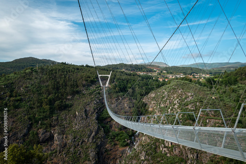 Vista parcial sobre a ponte metálica suspensa sobre o rio Paiva em Arouca, Portugal photo