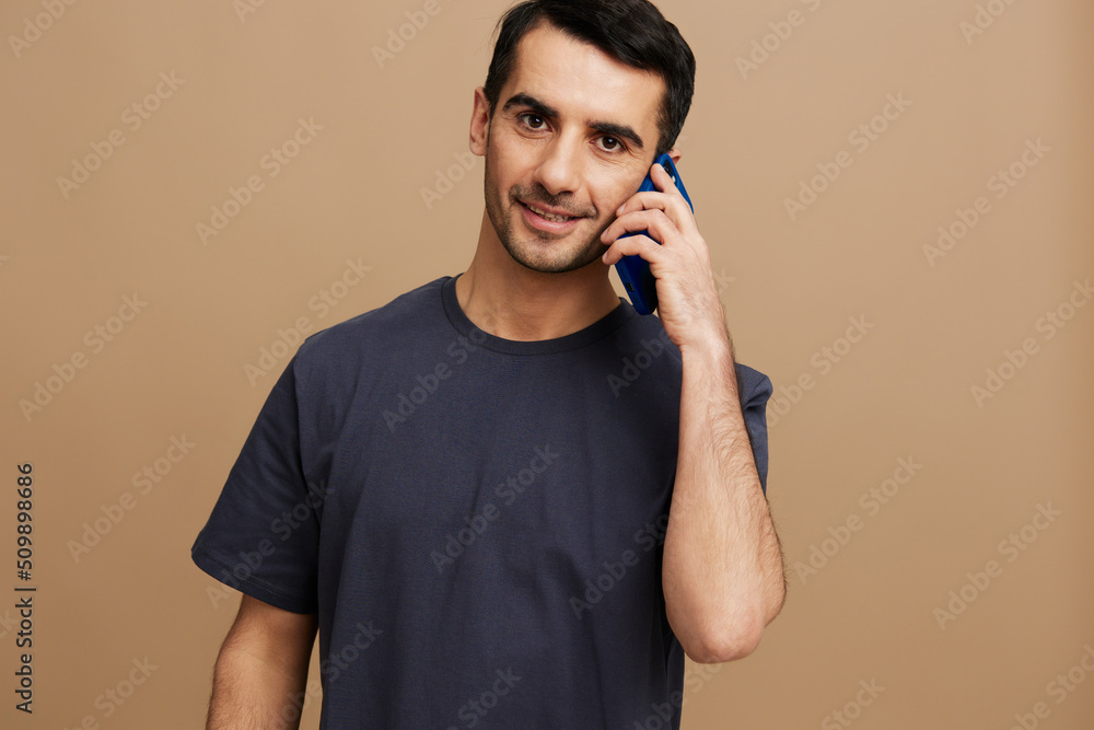 portrait man gray t-shirt uses the phone cropped view emotions cropped view portrait man gray t-shirt uses the phone cropped view emotions cropped view