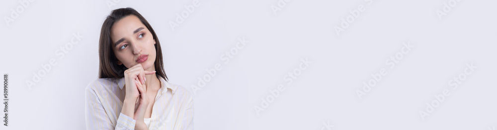 Portrait of a beautiful young woman thinking, isolated on white background Portrait of a beautiful young woman thinking, isolated on white background