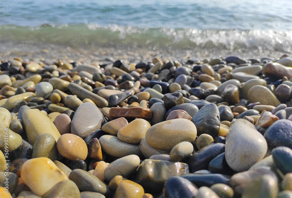Pebble stones on sea shore natural background. Soft partial focus Pebble stones on sea shore natural background. Soft partial focus