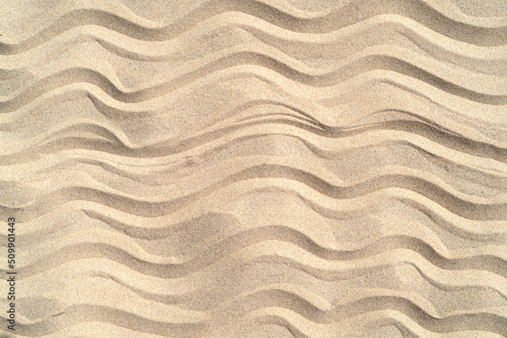 Texture of sea sand background closeup with ornament Texture of sea sand background closeup with ornament