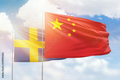 Canvas Print Sunny blue sky and flags of china and sweden