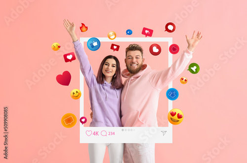 Happy young bloggers on pink background photo