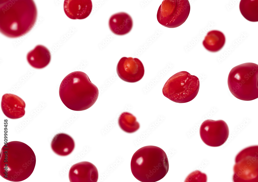 Sliced and whole falling cherries isolated on a white background. Flying cherry. Sliced and whole falling cherries isolated on a white background. Flying cherry.