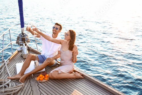 Happy young couple resting on yacht © Pixel-Shot