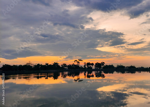 sunset over the lake. landscape photos of dusk on the river, dusk on the reservoir, photos of the evening sky.  Located in Siman Kediri Reservoir, East Java, Indonesia photo
