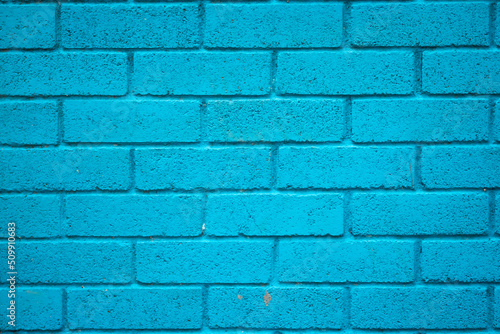 Cyan Painted Brick Wall a Little Dirty from Wear and Tear
