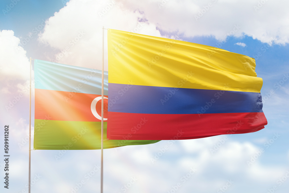Sunny blue sky and flags of colombia and azerbaijan Sunny blue sky and flags of colombia and azerbaijan