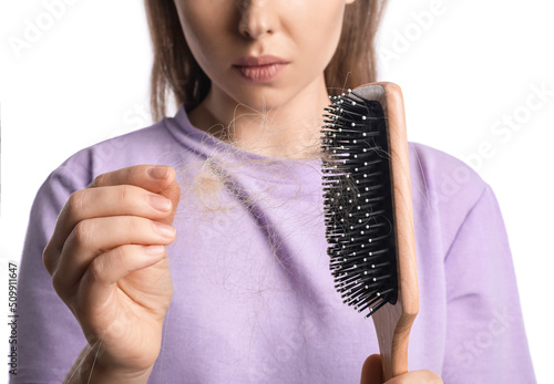 Young woman with hair loss ...