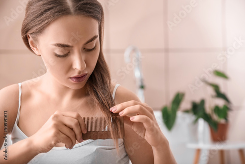 Young woman with hair loss ...