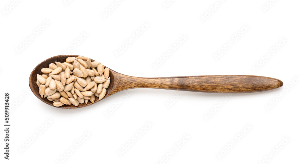 Wooden spoon with peeled sunflower seeds on white background Wooden spoon with peeled sunflower seeds on white background