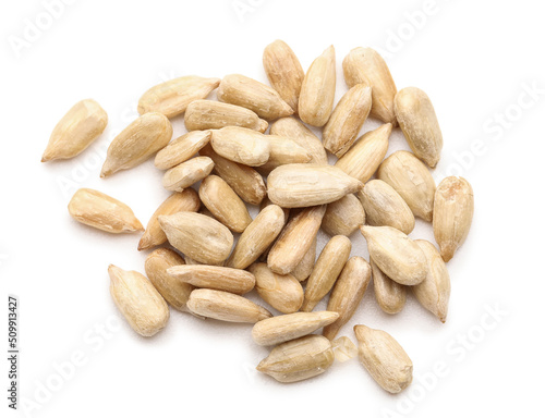 Peeled sunflower seeds on white background, top view