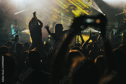 Two woman in the crowd at a music festival