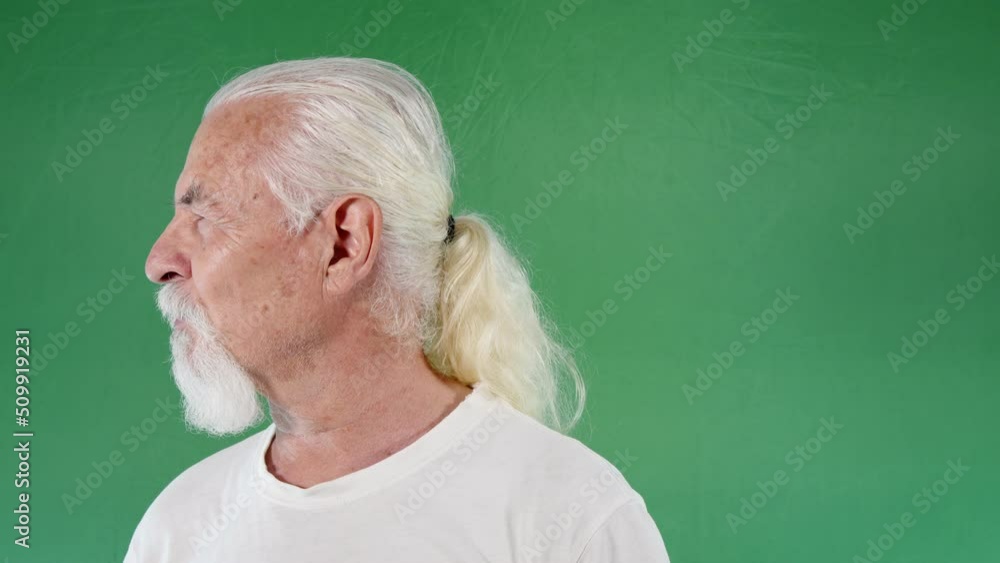 Man turns around and waving while talking to someone Man turns around and waving while talking to someone