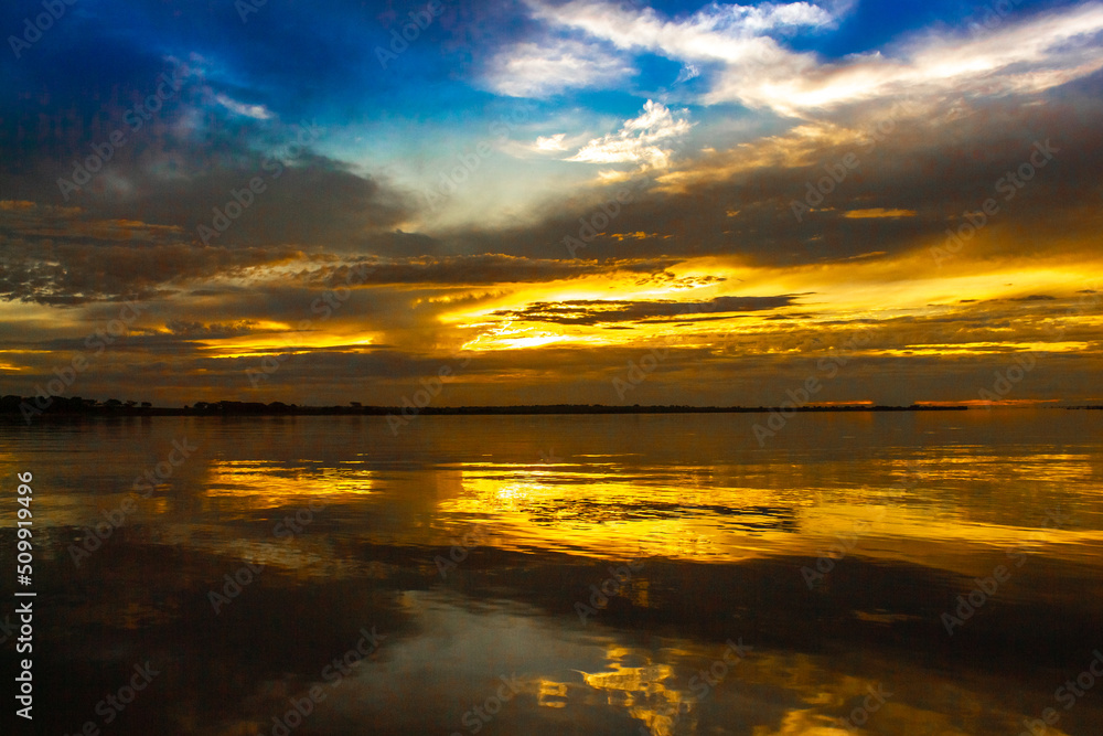 Obraz premium sunset over the river