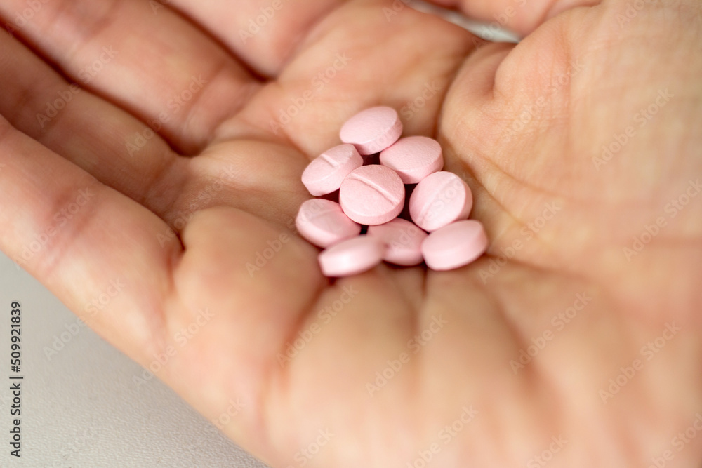 Hand holding medicine pills. Selective focus. Hand holding medicine pills. Selective focus.