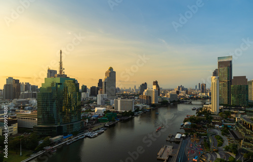 Chao Phraya River with Taksin bridge and building of Bangkok city with sunlight in the morning  Thailand