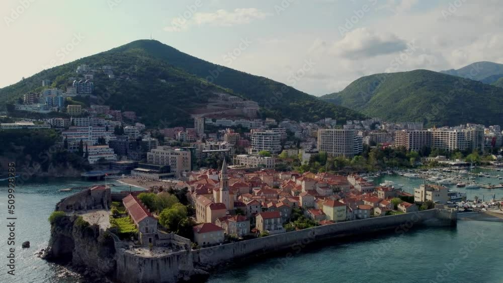 Budva, Montenegro old town and harbor. Sea and mountains. Budva, Montenegro old town and harbor. Sea and mountains.