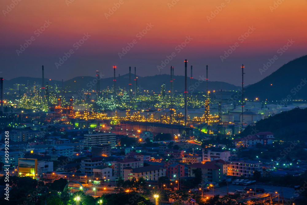 Oil refinery industry factory, petrochemical plant at sunset