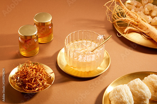 Front view of birdnest bowl with goji berry with cordycep in wooden table background 