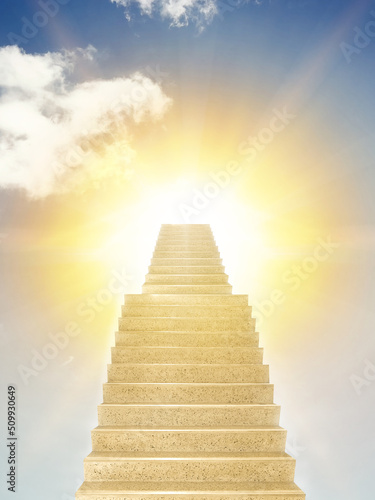 Concrete stairs leading up towards light. Concept of hope and bright future