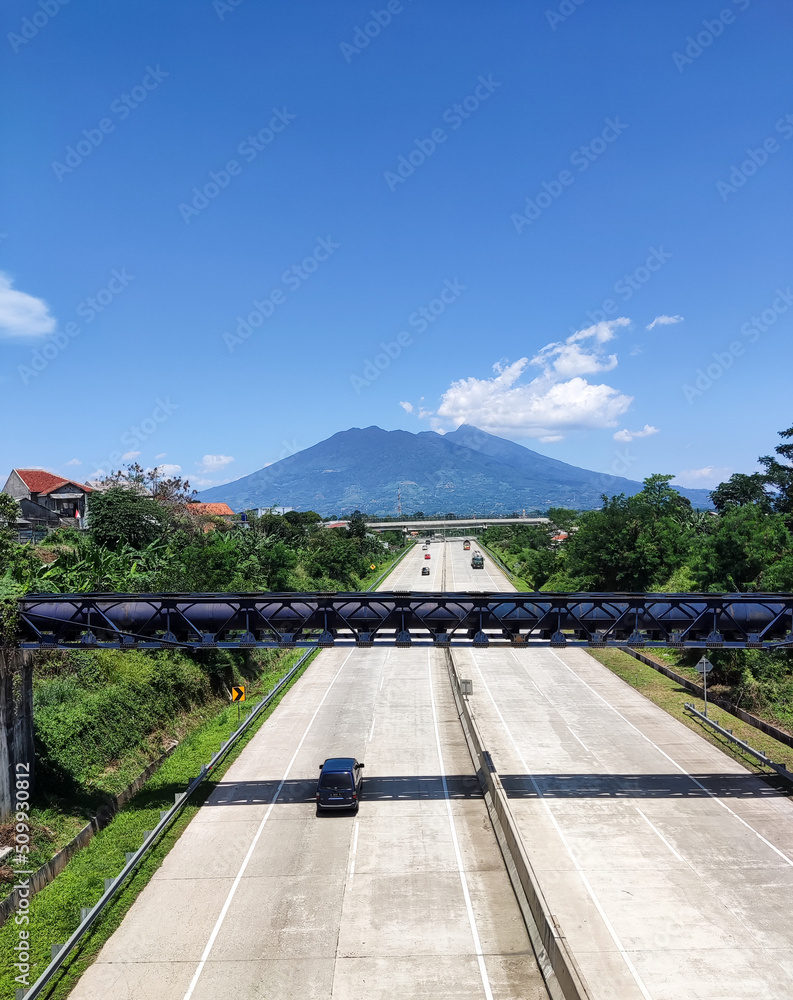 Mountain view and highway. Ciawi, Indonesia.