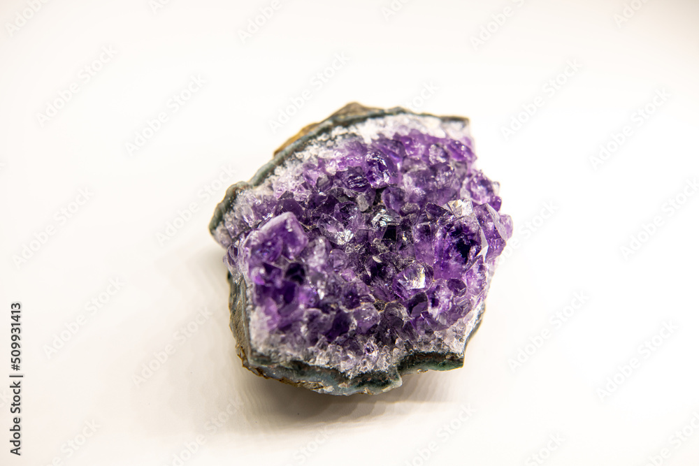 Amethyst geode on the white background, purple gemstone, horizontal image with copy space for text, close up image