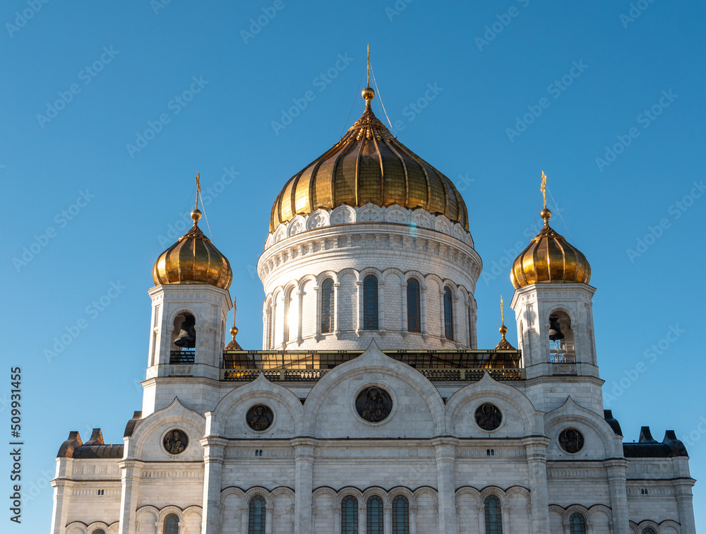 Close-up of the Cathedral of Christ the Savior with golden domes against the blue sky. Moscow, Russia