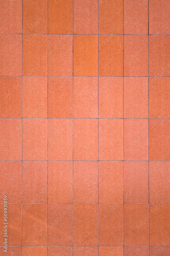 Fototapeta premium Pastel Orange Building Wall in Bright Daylight.
