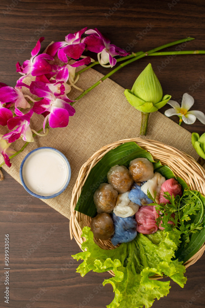 Thai dessert concept, Thai coconut milk custard and tapioca balls with pork filling on basket