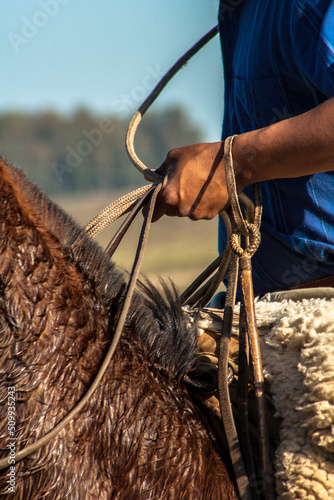 detail of a cowboy with the lasso in his hand. this worker from the south of brazil is called a gaucho
