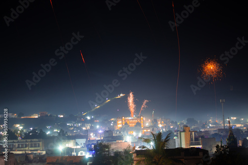 Wide angle shot of fireworks above the city during the new year festival in India. Celebration background. Fireworks in the sky above the city, Celebration background. Background of city with firework