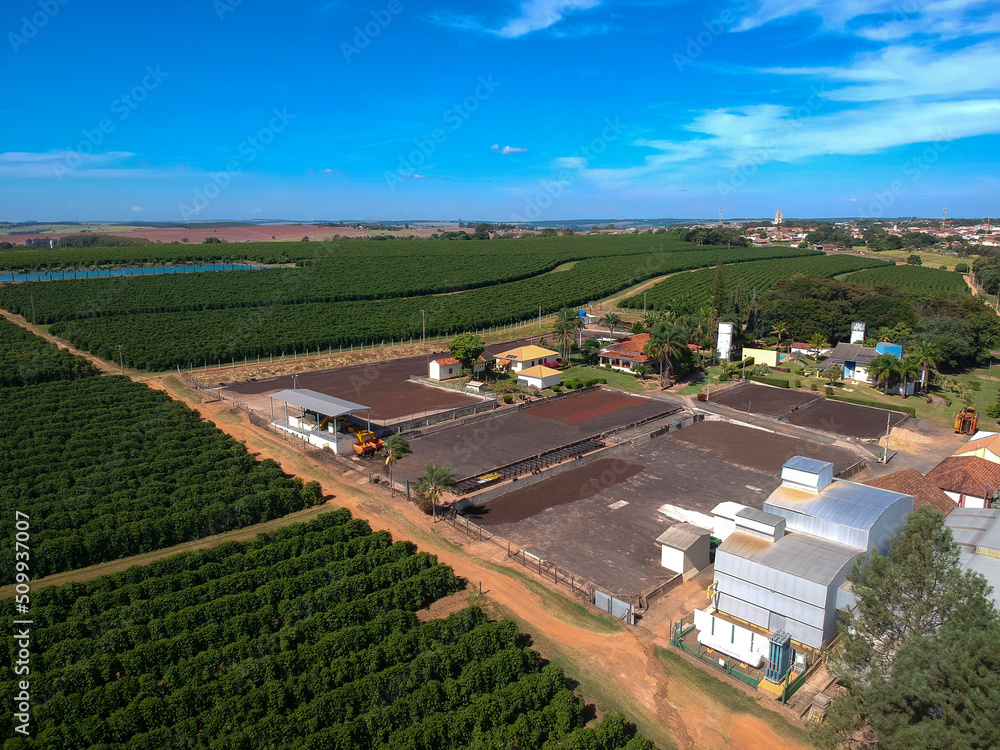 Drone view of the yard for drying freshly harvested coffee beans from a farm in Brazil