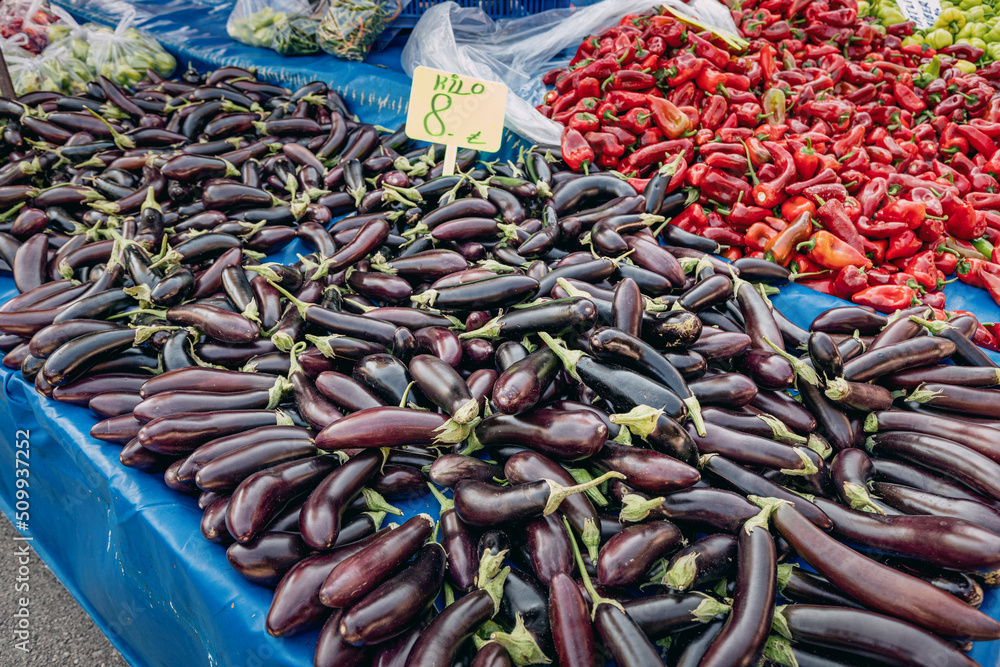 Fototapeta premium Sale of fresh abundant eggplant harvest at a local farmer's market in Turkey