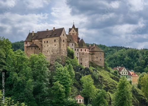 The Romanesque-Gothic stone castle Loket in the Czech Republic on a high green mountain is loved by tourists from all over the world.