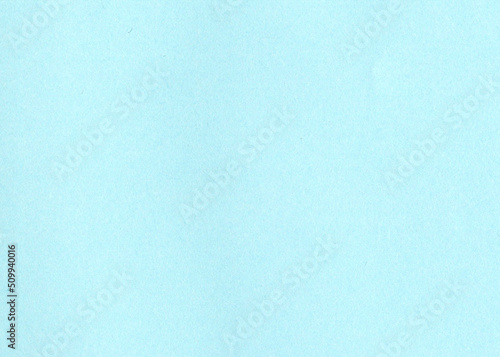 High resolution close up large image of light, sky, baby blue uncoated paper texture background with fine grain fiber and dust particles smooth matt wallpaper with copy space for text