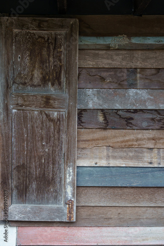 Old weathered wooden surfaces walls with longboards lined up with grain and texture for background.