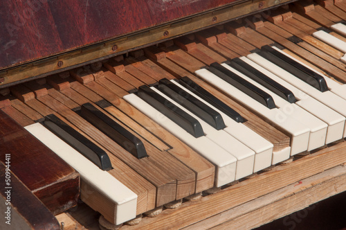  broken and dusty piano claviature photo