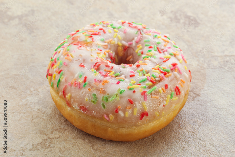 Sweet glazed vanilla donut with icing Sweet glazed vanilla donut with icing