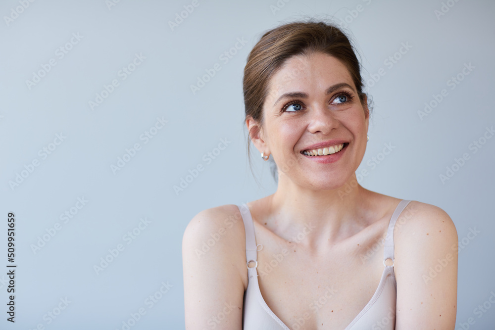 Smiling woman with naked shoulders. Long hair and short hair dress. Smiling woman with naked shoulders. Long hair and short hair dress.