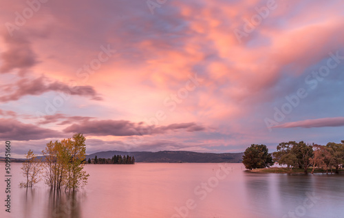 Glorious warm sunset colours over lake Jindabyne, in the Snowy Mountains of Australia photo