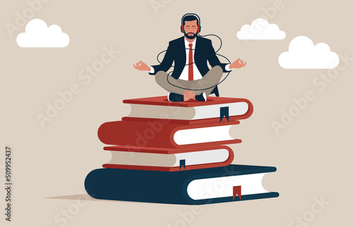 Smart entrepreneur meditating and learn new skill on stack of business books. Best book to help entrepreneur success in business, knowledge or skill to succeed and overcome obstacle.