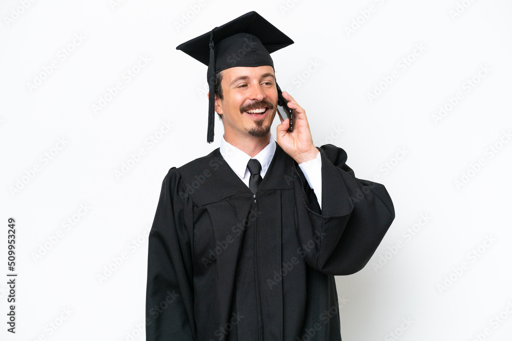 Young university graduate man isolated on white background keeping a conversation with the mobile phone Young university graduate man isolated on white background keeping a conversation with the mobile phone