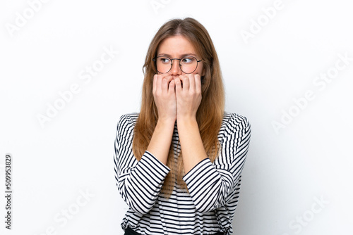 Young caucasian woman isolated on white background nervous and scared putting hands to mouth