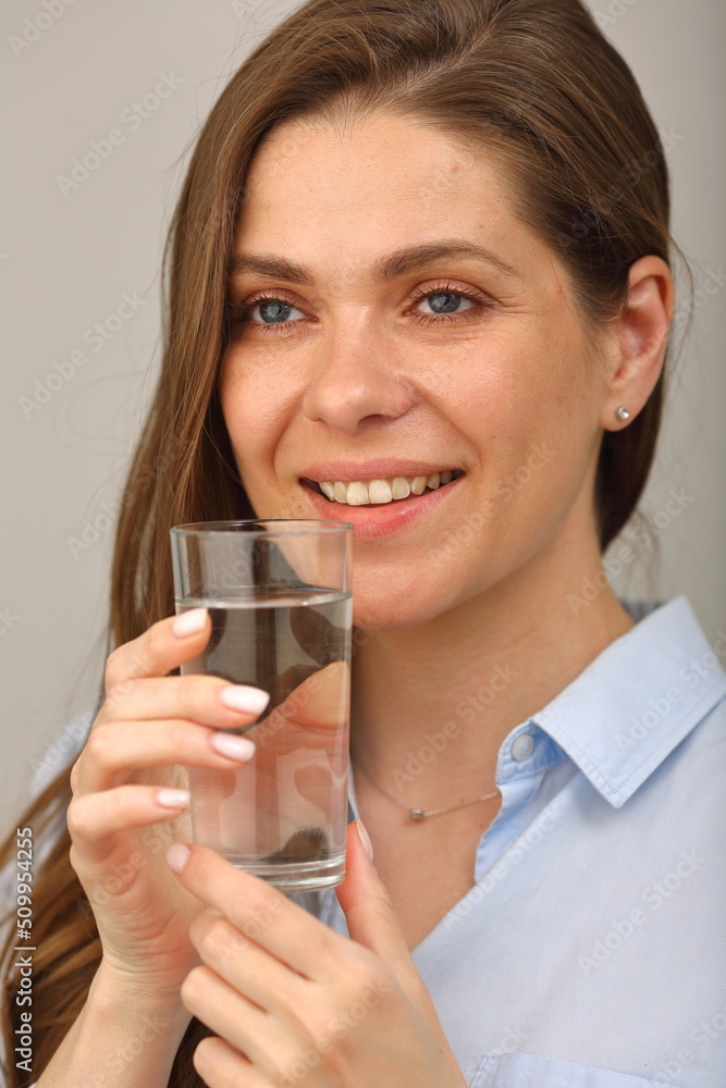 Woman drink water from glass. Close up face portrait, girl looks away. Woman drink water from glass. Close up face portrait, girl looks away.